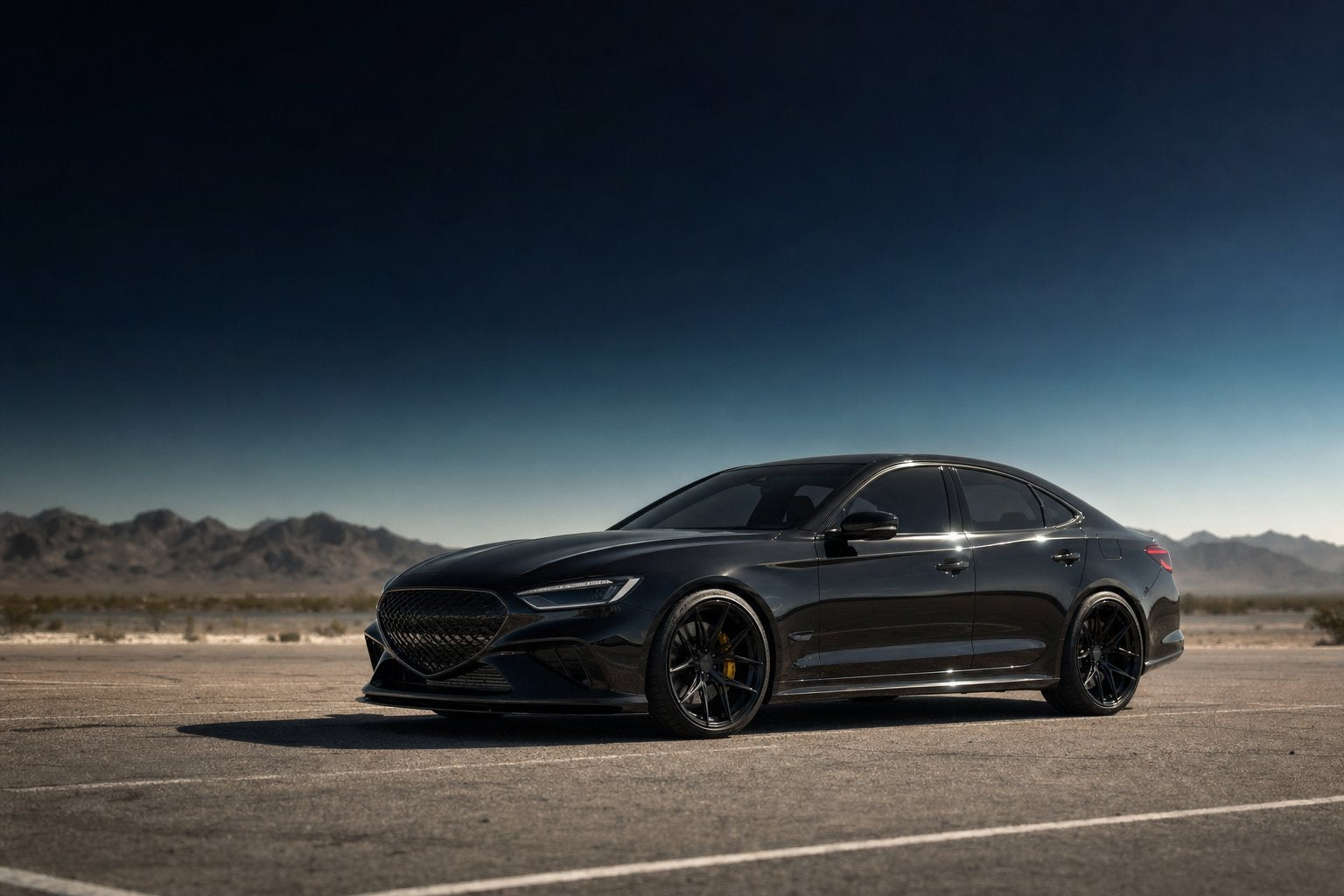 Black sports sedan on hot asphalt in midsummer heat with visible heat mirage