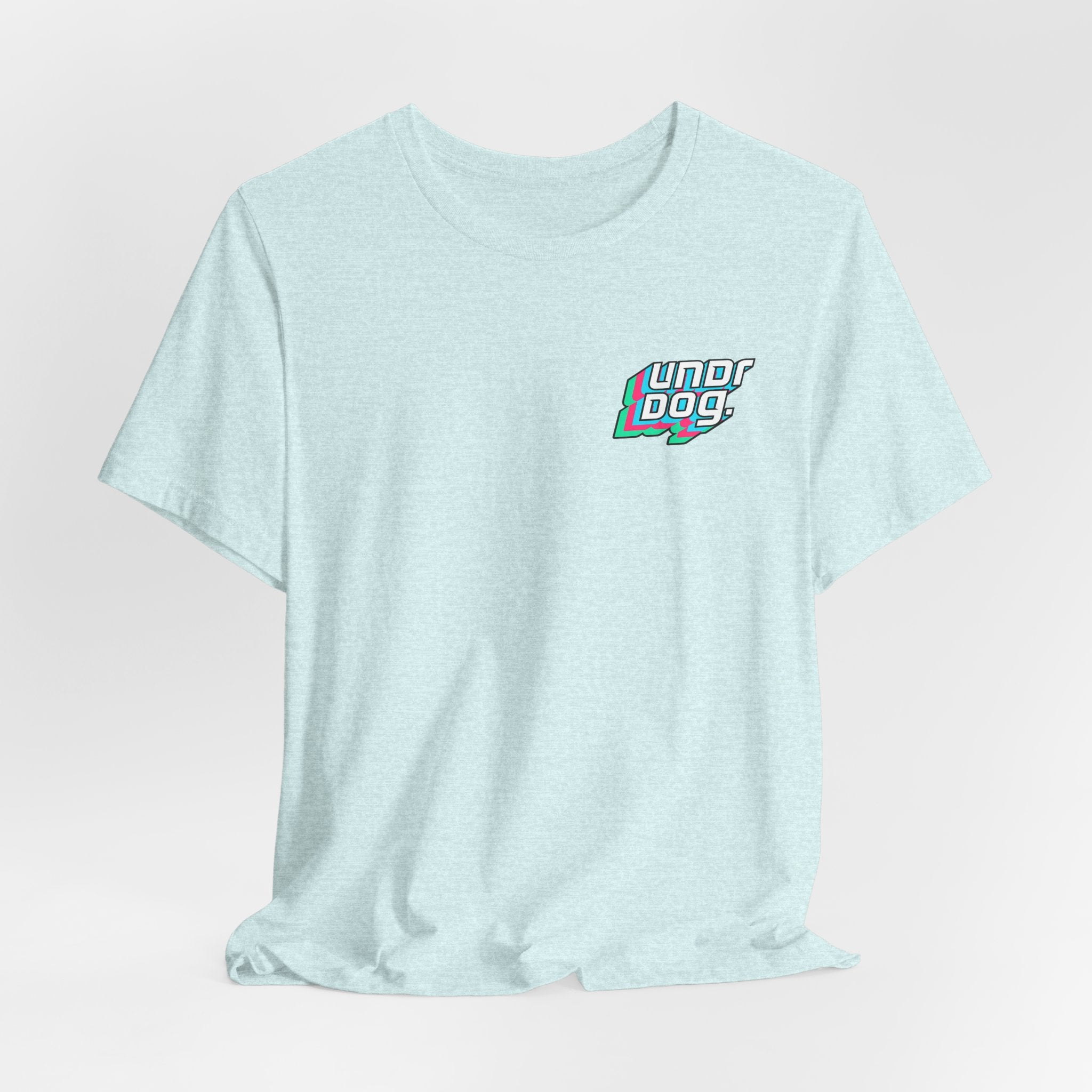The Printify See Yourself In It Retro Sportscar Tee features a light blue color with a small, colorful "Underdogs" logo on the left chest, shown against a plain white background.