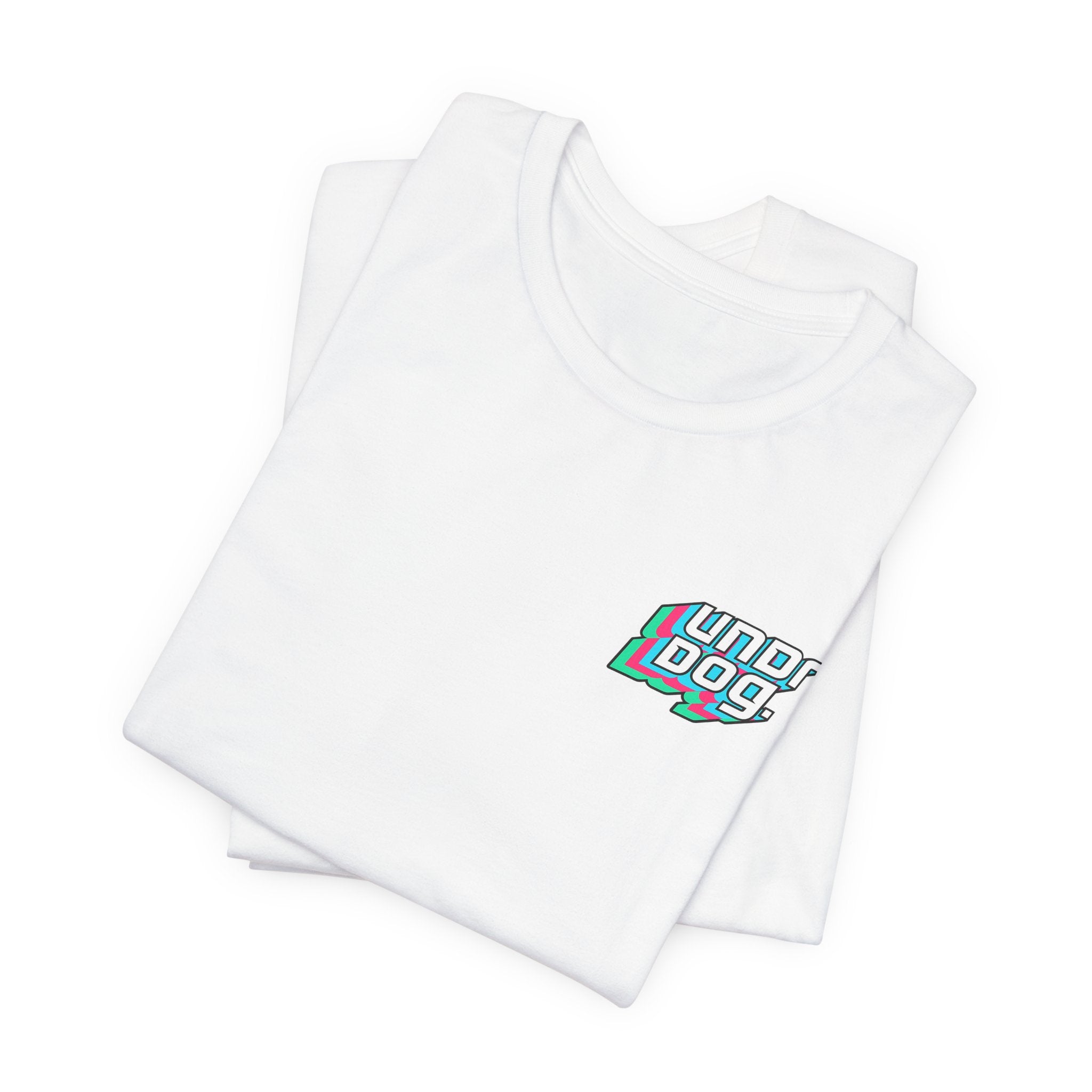 A folded white Unisex Jersey Short Sleeve Tee from Printify, made with soft Airlume combed cotton, showcases a small, vibrant "underdog" graphic in stylized text on the left chest. This tee delivers modern comfort and style, making it an ideal everyday essential.