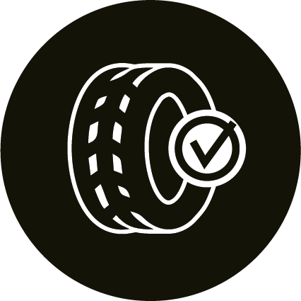 Icon of a tire with tread marks, featuring a checkmark inside a circle to the right, all in white against a black circular background.