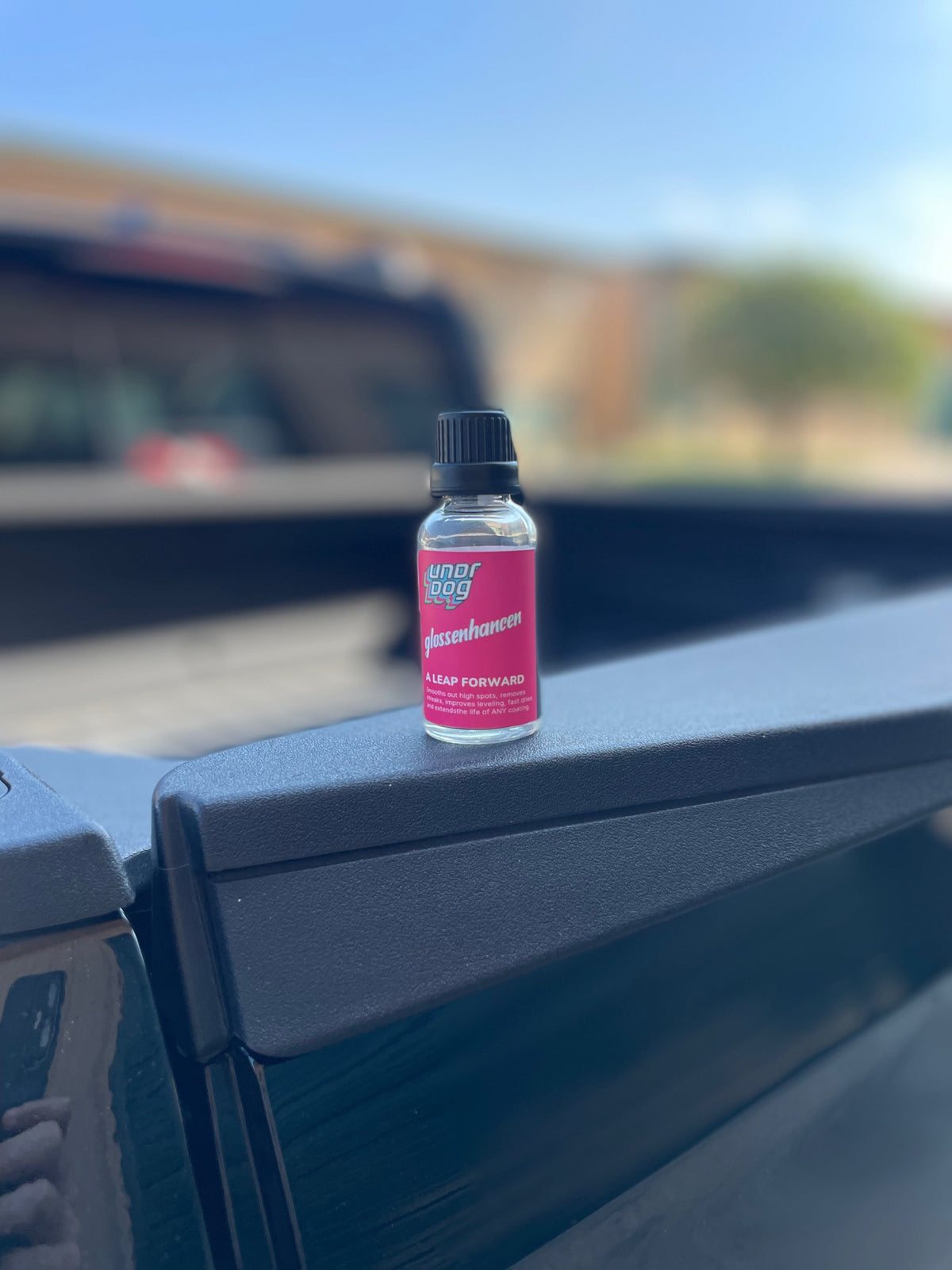 Undrdog Glossenhancen 30 mL bottle with black cap and pink label