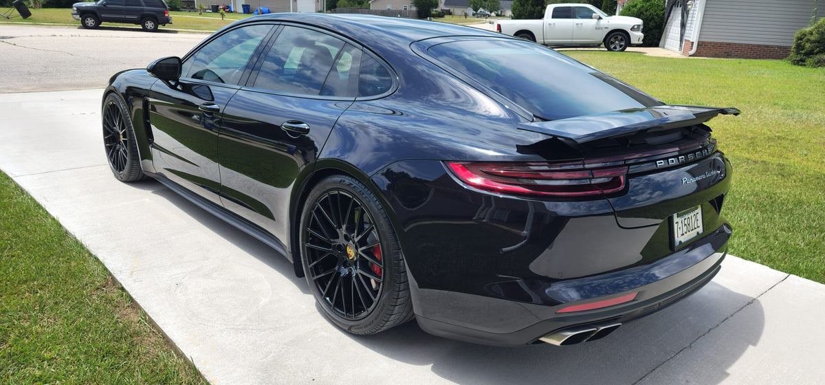 2 part ceramic coating for cars — dark sports car with mirror finish under overcast light
