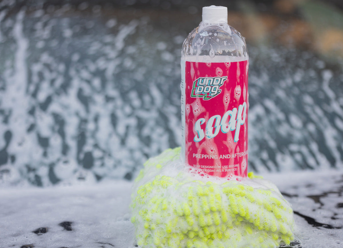 Undrdog Soap bottle resting on a microfiber wash mitt