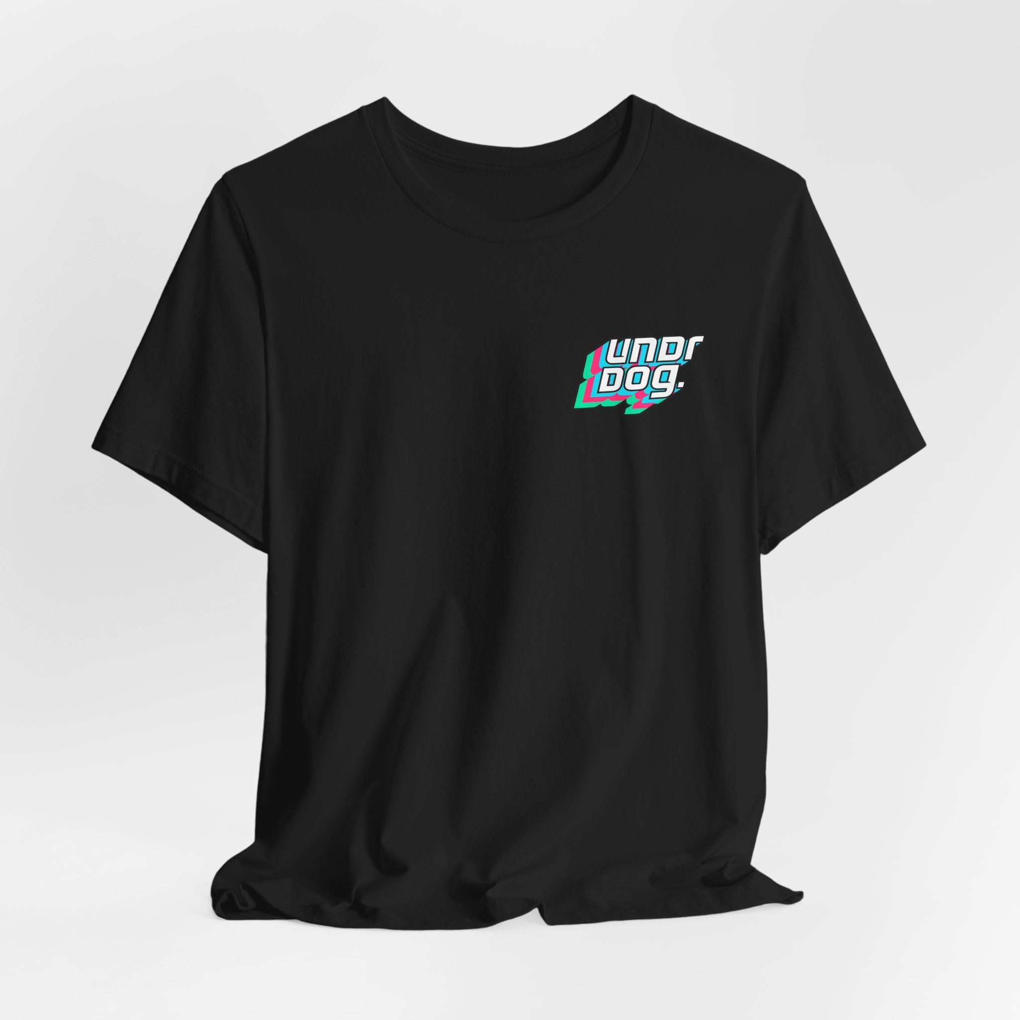 The See Yourself In It Retro Sportscar Tee by Printify is a black synthwave-style shirt featuring "Underdog" in stylized white, teal, and red text on the left chest, displayed against a plain white background.